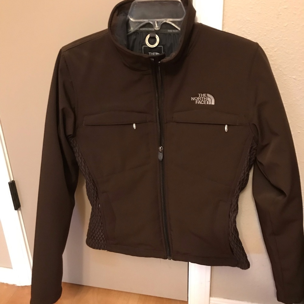 The North Face Woman’s Primaloft brown jacket.